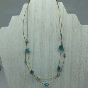 Gold tone blue cubed  , thin choker , two strand.